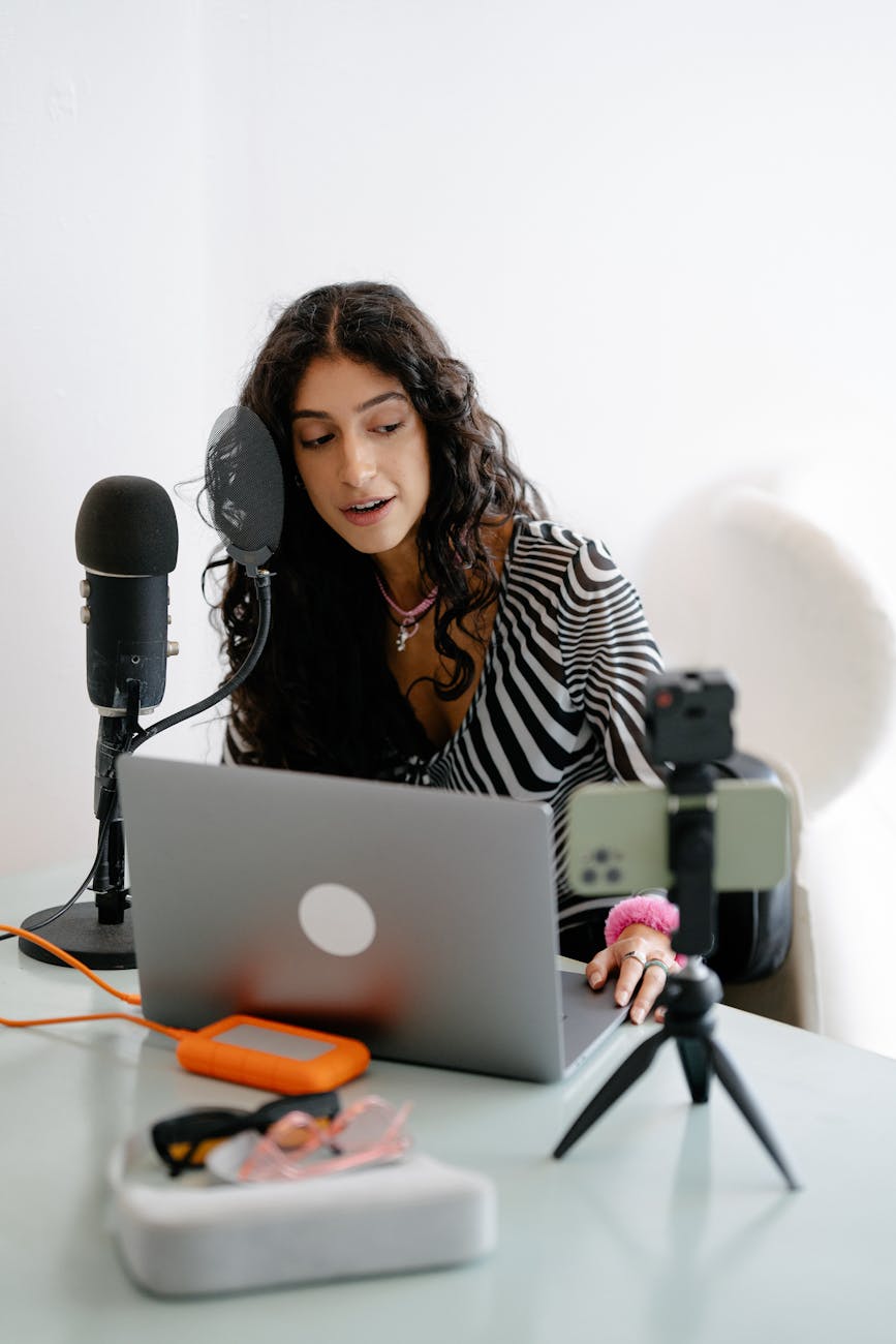 woman recording by desk